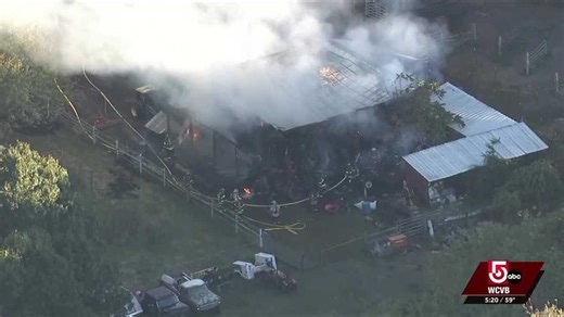 Lancaster, Massachusetts, barn fire sends thick smoke into the sky, roof collapses