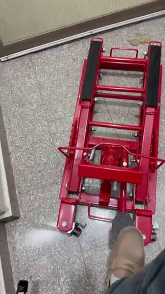 Big Red Hydraulic Motorcycle Lift.