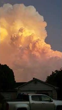 Cumulus clouds at sunset. Time lapse.