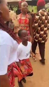 Igbo Bride Dancing with Her Bridal Clue in Full Traditional Elegance