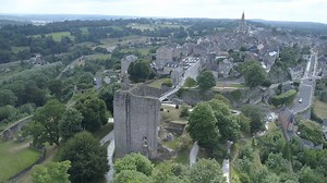 Take a stroll through medieval Domfront, with its paved narrow streets, towers, remains of the dungeon and its beautiful romanesque church located by the river. | Normandy, France
