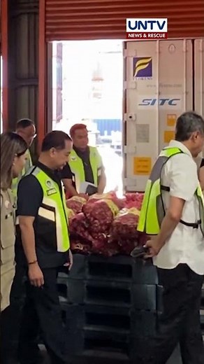 Government officials inspect 26 containers of imported onions from China worth over ₱36 million