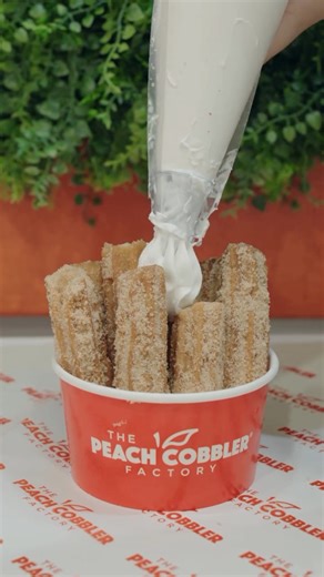Golden, crispy, and topped with creamy dulce de leche goodness. 癩✨ These churros are the ultimate sweet indulgence from Peach Cobbler Factory. Treat yourself today. Order Now: bit.ly/getpeachyPCF | Peach Cobbler Factory - Pooler GA | Facebook