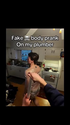 Endomorph on Instagram: "☠️ In this shocking prank video, a homeowner decides to test their plumber’s nerves by setting up a gruesome "fake body" scene in the bathroom. The video begins with the prankster preparing a lifelike dummy wrapped in plastic, complete with red-dyed water to mimic blood, and placing it in the bathtub behind a closed shower curtain. The tension builds as the unsuspecting plumber, Vinny, arrives at the home to address a supposed drainage issue. The homeowner leads the plum