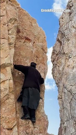 Monk climbing Mount Athos