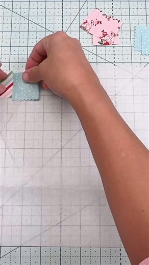 "The Little Green Bean" shares her personal experience with patchwork, admitting that it used to scare her due to the perceived complexity of matching everything perfectly and sewing tiny pieces. However, she discovered a "little trick" that makes creating a patchwork panel easier than one might think. She then outlines the steps for this technique: * Cut your squares to your desired size (hers are 1 1/2"). * Press them to the fusible side of the interfacing. * Sew one side of rows first, ensuri