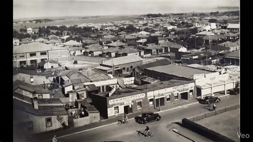1933 - An AI generated street scene of Fourth Street, corner Third Avenue, produced from an original single photo. The Lewis & Co building was to be demolished a few years later and the Palladium Bioscope built in its place. Note Kapelus Bros building in the background. The other double story white building in the distance still stands today on the corner of 5th Avenue and 7th street. | Springs - History of a Gold Town