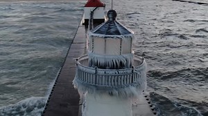 FROZEN! An early season polar vortex brought 20 foot waves,60mph winds and sub zero windchills, creating some beautiful lighthouse ice❄️ sadly it won’t last long! View in HD, thank you for sharing 💙 Saint Joseph, Michigan 12/6/24 **To use in a commercial player contact licensing@storyful.com** | Nates Dronography