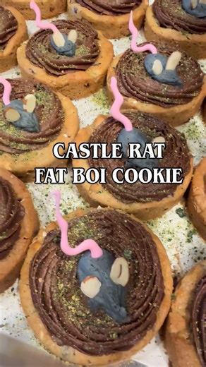 Annie Dickson on Instagram: "🐀 Our @sonictemplefestival countdown has OFFICALLY begun, Creeps! We’re kicking things off with the CASTLE RAT fat boi. A bonfire inspired cookie with marshmallows, cinnamon grahams & chocolate chips topped with chocolate buttercream, and the Rat of the Castle himself (name TBD) Only available THIS WEEK 🤘🏼 our roadtrip to rock begins tomorrow at 9am - don’t forget you can Scan the QR code in store to enter for your chance to win 2 GA passes! #sonictemple #bitethis