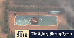 Fire-fighting helicopters resort to using swimming pools