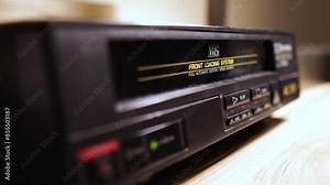 Loading and Starting Playback of VHS VIdeo Cassette Tape in VCR From 1990's, Close Up