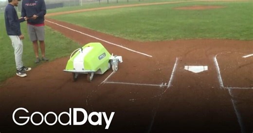 Esteban is checking out the robot, Turf Tank!