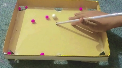 Enjoying a Fun Game of Mini Snooker!