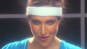 Megan Amram Teaches Women's Baby Brains How To Science, In Her Olivia Newton John-Themed Book Promo