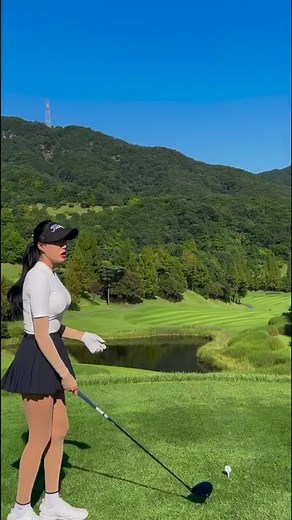 Woman Perfecting Her Golf Swing on Beautiful Course