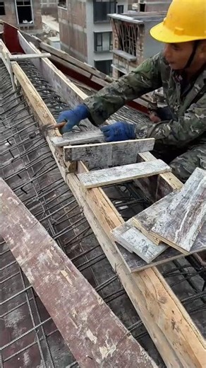 assembling wooden formwork over steel reinforcement using a hammer #shorts