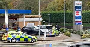 Armed cops surround car at Tesco petrol station in huge police response