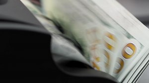 Money cash counting equipment. Slow motion. Bank automatic equipment for counting paper money