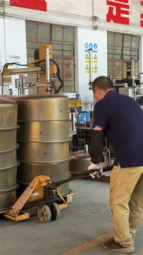 Factory Worker Moves Heavy Metal Drums with Manual Pallet Jack | Industrial Workshop Operations