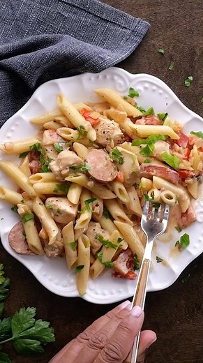 Cajun Chicken Pasta with Andouille Sausage is creamy and really packs the flavor!