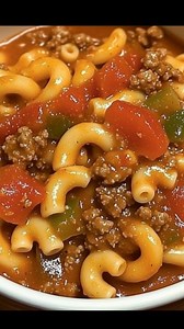 Crockpot Goulash Recipe American goulash is an old-fashioned meal that is sure to keep your taste buds happy and your belly full. Ingredients: 2 pounds ground beef 1/2 onion diced 1 green bell pepper diced 1 red bell pepper, diced 1 tsp. Minced garlic 1 tsp. salt 1 tsp. pepper 2 tsp. Italian Seasoning 2 cans tomato sauce14.5 oz 2 cans diced tomatoes 14.5 0z 2 cups beef broth 1 box dry uncooked macaroni 1 cup frozen peas How To Make Crockpot Goulash Recipe: In a skillet over medium heat, cook gro