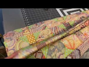 Accordion folding my quilt top for the final seam