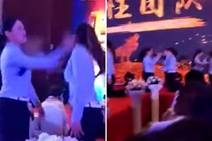 Bizarre viral video shows a dozen women forced to slap each other across the face in 'team building exercise' at Chinese firm's end-of-year gala