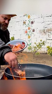 201K views · 2.9K reactions | Golden, crispy chicken wings sizzling in a pan over open fire – surrounded by nature. Juicy inside, smoky outside – pure flavor in every bite. A rustic moment of taste, crafted by Kanan Badalov with simplicity and soul. #KananBadalov #ChickenWings #OpenFireCooking #OutdoorGrill #CampfireCooking #BBQVibes #rusticfood #panfriedcod #firecooking #grilledchicken #FoodInNature #cooking | Fire Up, Bro | Facebook