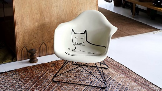 In collaboration with the Eames Office and Herman Miller, #Vitra is now producing a limited edition of 500 pieces of the Eames Fiberglass Armchair with #Steinberg Cat. For this purpose, a specialised firm scanned the original at the Eames Institute and generated a 3D file. The data was used to create an exact template, which makes it possible to apply Steinberg's drawing to the fibreglass shell as faithfully as possible. This is done manually on each individual shell by a skilled artist, using p