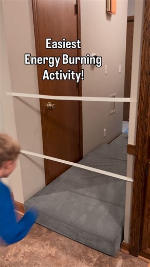 Brittany | Kids/Toddler/Baby Activities on Instagram: "We LOVE an easy, energy burning activity. Especially now that it’s dark outside by the time we finish eating dinner 😭. For this activity we put out our play cushions and placed some masking tape on the wall. Version 1: try to jump between two pieces of tape Version 2. jump over one piece of tape. After every round, move the tape up higher. See how high you can jump before you break the tape! Inspired by: @creativeplay.grace"