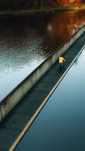 Is this the most beautiful bicycle path in the world? 'Cycling through Water' in Bokrijk Belgium is a unique cycling experience in which you cycle more than 200 meters through a pond. | News View