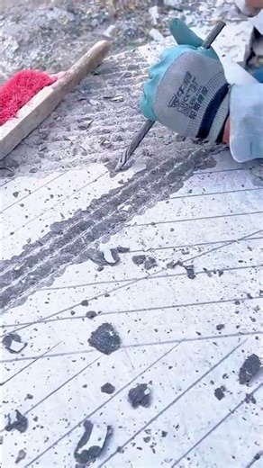 Manual Tile Chiseling for Precise Floor Surface Preparation Work