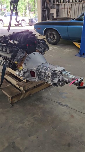 Hemi 6.4L engine with Tremec 5-speed ready to install in the B5 blue 1970 Dodge Challenger