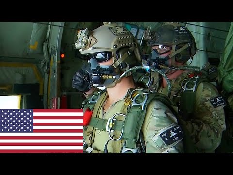 US Army Special Forces (Green Berets) perform a high-altitude jump from a C-130 Hercules.