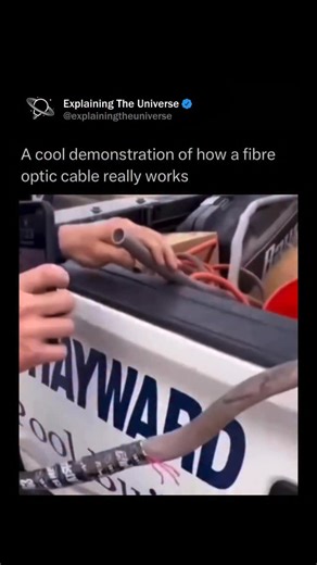 Explaining The Universe on Instagram: "A fiber optic cable is a high-speed data transmission cable that uses thin strands of glass or plastic fibers to carry information as pulses of light. At its core is the optical fiber, which guides light through a process called total internal reflection, allowing signals to travel long distances with very little loss. Surrounding the core is a cladding layer that keeps the light confined, followed by protective coatings, strength members, and an outer jack