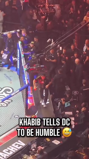 Khabib Nurmagomedov stopped by the commentators’ desk to tell Daniel Cormier to “put his eyes down,” as his teammate Islam Makhachev just became a two-division champion, something DC himself accomplished during his UFC career. Daniel explained that Khabib meant he can no longer place his own accomplishments above Islam’s and should stay humble, as Makhachev is now equal to DC. | Red Corner MMA