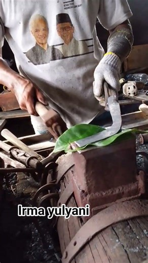 the process of a blacksmith smoothing the tip of a rubber tapping tool⚒️ #blacksmithing #ironwork