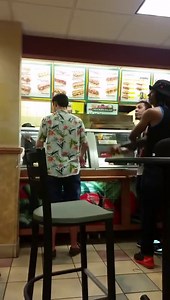 A violent fight to Subway, a man passes through the glass