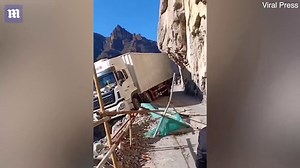 Video: GPS Fail: Nailbiting scene of a truck dangles from 330ft cliff in China | Daily Mail Online