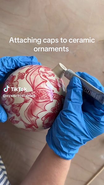 Behind the scenes: attaching ornament caps to ceramics ❤️✨ For anyone curious about how I finish these, I like to use E6000 to secure the topper. It keeps the cap from spinning, but I don’t epoxy the pin inside the ornament. While you can put E6000 down into the neck of the piece, I decided against it — just in case the pin ever needs to be replaced or you want to easily swap out the ribbon later on. If you get any stray E6000 on the neck or the cap, a little rubbing alcohol and a Q-tip will cle