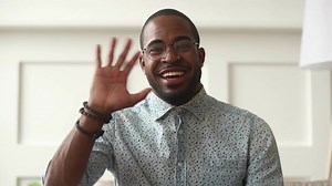 Happy black man video calling looking at camera communicate in internet, cheerful african male coach talking laughing enjoy online conversation, smiling guy blogger recording vlog webcam view