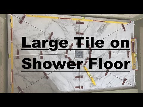 Large tile on shower floor. Tile Relief Cuts. Shower Floor Tile. Shower tile.