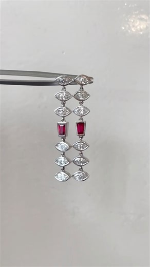 24 reactions · 10 comments | A touch of danger. A flash of fire. Our Platinum Marquise Diamond & Ruby Drop Earrings command the night with every shimmer.  1.80 carats of marquise diamonds, accented by tapered baguette rubies — a masterpiece of timeless seduction. #MarisaPerryAtelier #finejewelry #diamondearrings #dropearrings #rubyjewelry #platinumearrings #vampireglam #luxuryjewelry #gothicelegance #statementjewelry | Marisa Perry Atelier | Facebook