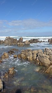 Rocks and waves at the Coast of Cape Agulhas in South Africa