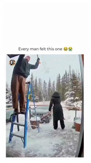 MemeDrop.Daily on Instagram: "Bells rang hard that day Follow @memedrop.daily for more! This funny couple fail video shows a husband cleaning snow off the roof using a snow shovel during winter, thinking everything was going smoothly until a hilarious accident happened. After handing the shovel to his wife, she casually placed it on the ground without realizing it was set up for disaster. As the husband climbed down the ladder from the roof, he stepped right between the shovel just as his wife a