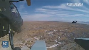 Watch live-fire drills staged by Chinese combat helicopters in the southwest of the country. | China Xinhua News