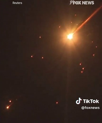 TEL AVIV TARGETED: Missiles could be seen in the night sky over Israel as air raid sirens blared across the city and Israeli defenses worked to intercept incoming threats from Iran. Iran has increasingly used cluster-style warheads designed to break apart midair, releasing smaller explosives that can still reach the ground even after interception.