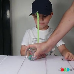 This is, perhaps, the simplest and the funniest magnet fishing game with paperclips! I taped a magnet to a pipe cleaner and attached it to the front of a cap with a clothespin. After that, boys were ready to catch colourful paperclips fishes. #TheDadLab | TheDadLab