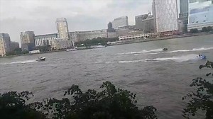 Police boats chase jet skiers along Thames River in London