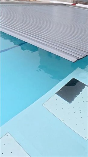 This pool cover disappears into the wall 😮
